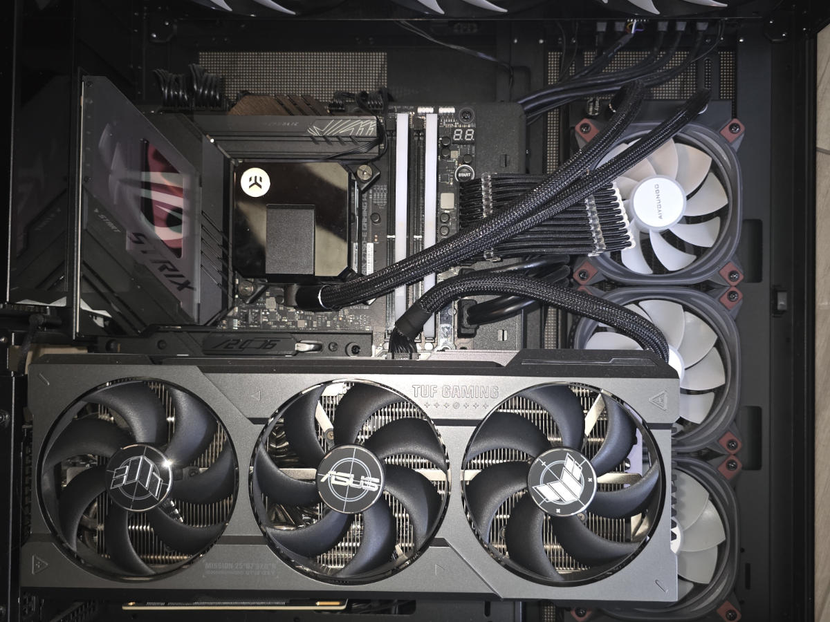 High-end custom gaming PC with ASUS TUF Gaming graphics and extensive liquid cooling