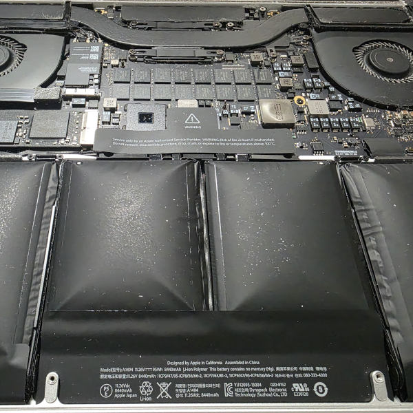 MacBook Pro opened for replacement of a severely swollen lithium battery